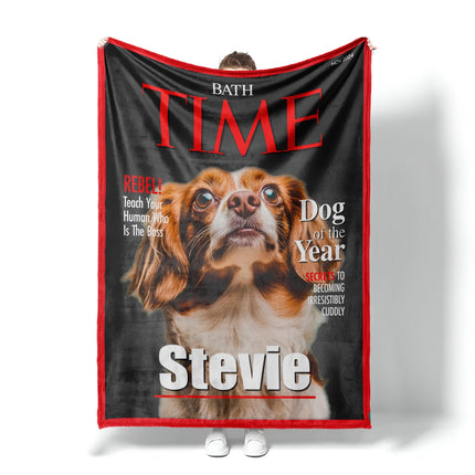 May include: A fleece dog blanket features a custom-designed Time magazine cover. The cover showcases a brown and white dog, identified as 'Stevie,' as the 'Dog of the Year.'  Red and black text highlights the magazine title and playful captions like 'Rebel' and 'Secrets to becoming irresistibly cuddly.' The blanket is a soft, plush material, perfect for pet owners who want a unique and personalized gift.