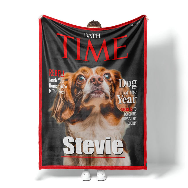 May include: A fleece dog blanket features a custom-designed Time magazine cover. The cover showcases a brown and white dog, identified as 'Stevie,' as the 'Dog of the Year.'  Red and black text highlights the magazine title and playful captions like 'Rebel' and 'Secrets to becoming irresistibly cuddly.' The blanket is a soft, plush material, perfect for pet owners who want a unique and personalized gift.