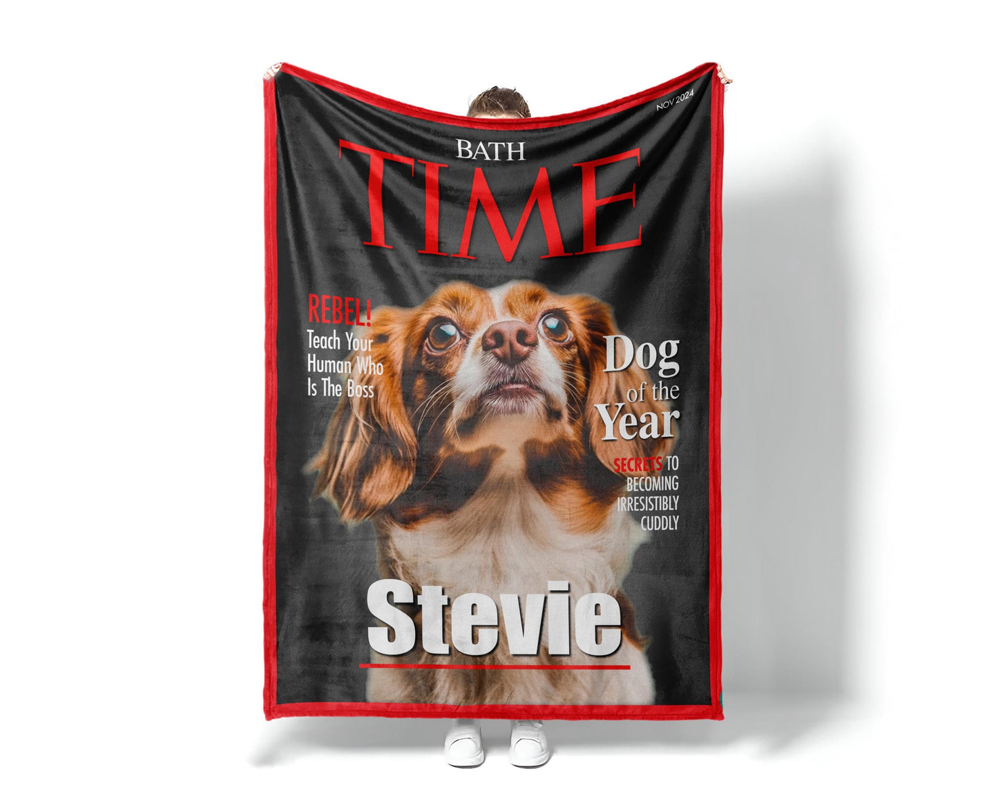May include: A fleece dog blanket features a custom-designed Time magazine cover. The cover showcases a brown and white dog, identified as 'Stevie,' as the 'Dog of the Year.'  Red and black text highlights the magazine title and playful captions like 'Rebel' and 'Secrets to becoming irresistibly cuddly.' The blanket is a soft, plush material, perfect for pet owners who want a unique and personalized gift.