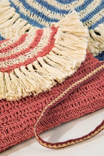 Bohemian inspired handmade jute cross-body bag featuring fringe detail with a fully lined pocket inside and a magnetic closure