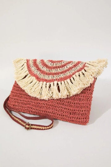 Bohemian inspired handmade jute cross-body bag featuring fringe detail with a fully lined pocket inside and a magnetic closure